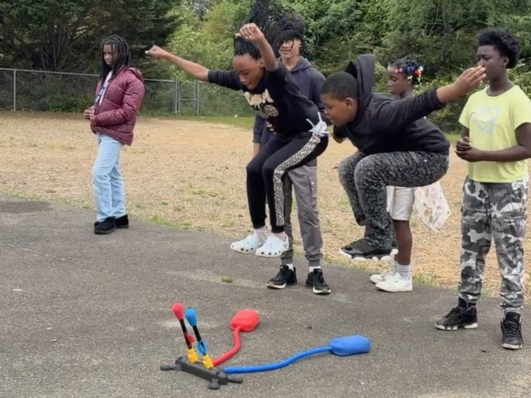 students playing with stomp rockets