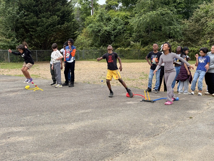 students playing with stomp rockets