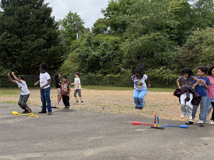 students playing with stomp rockets