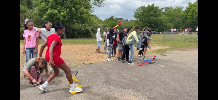 students playing with stomp rockets