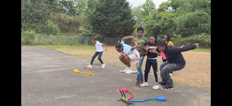 students playing with stomp rockets