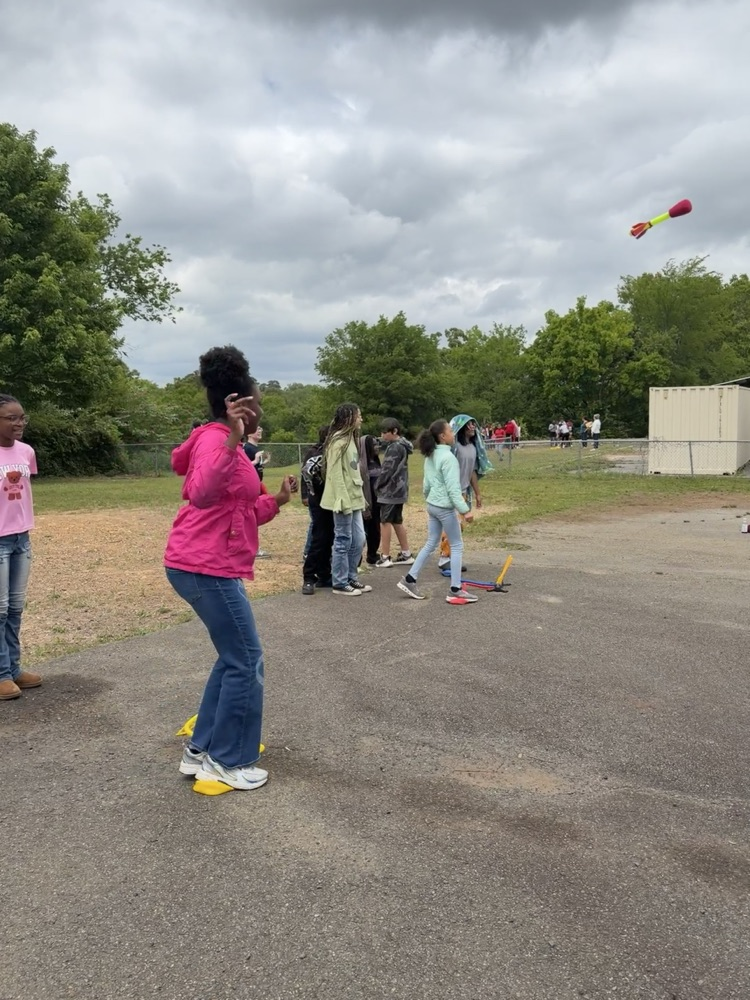 students playing with stomp rockets