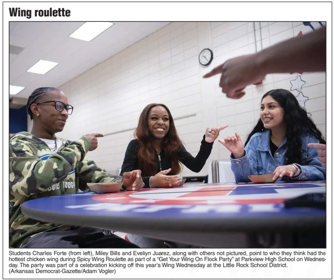A photo from the Arkansas Democrat-Gazette of Parkview students playing spicy wing roulette