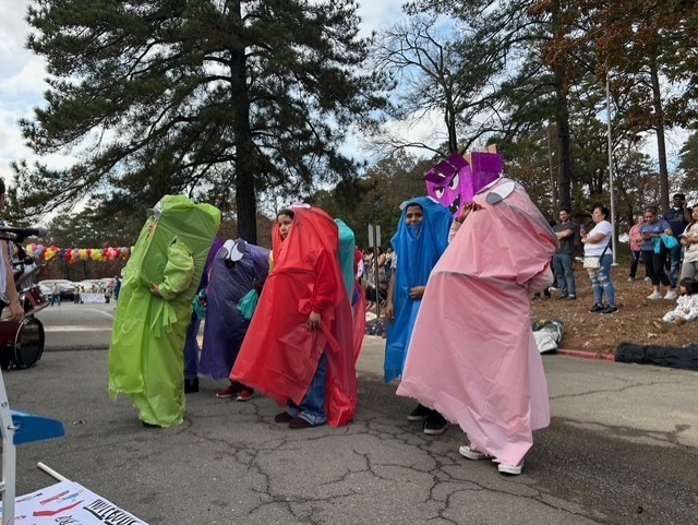 Students marching in Book themed parade.