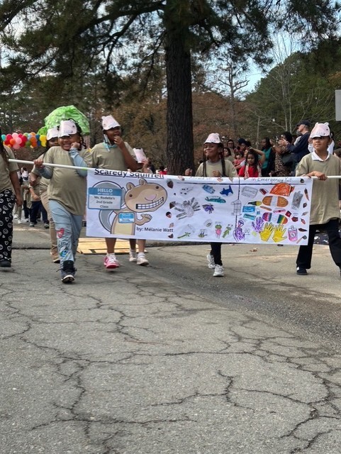 Students marching in Book themed parade.