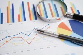 magnifying glass and charts