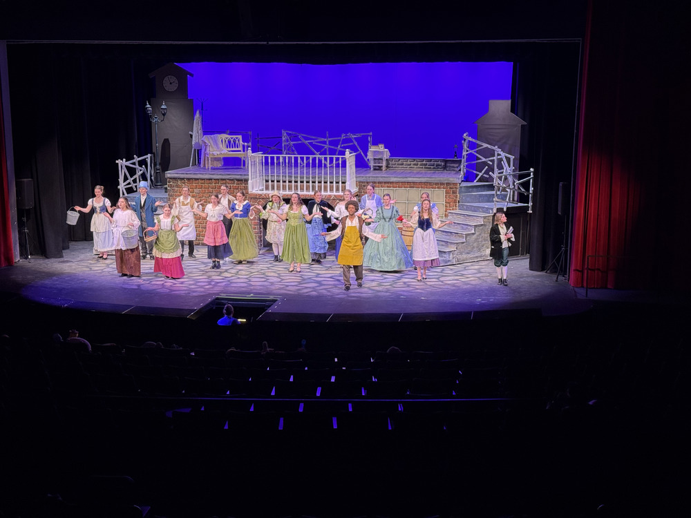 Thespians performing a song from Oliver!