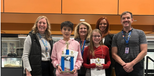 LPS spelling bee winners with adults at EPIC Campus