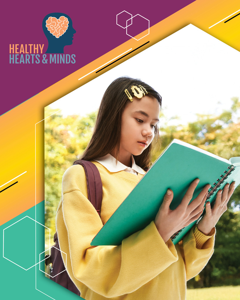 A girl reads a book, with a "Healthy Hearts & Minds" logo and geometric shapes framing the image.