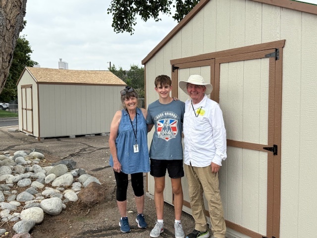 Boy Scout working with Sweet Dream in a Bag program for a shed project