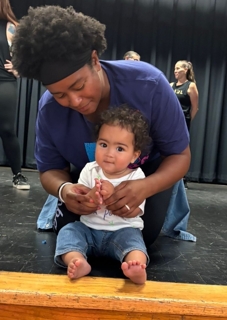 Mother and infant during a Zumba fundraiser