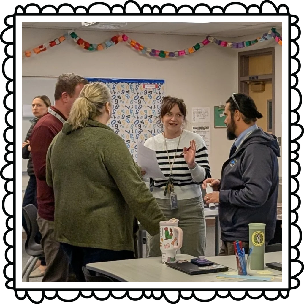 A group of teachers discussing and learning together
