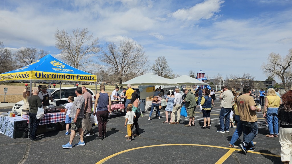 photo of community gathering around the food tents