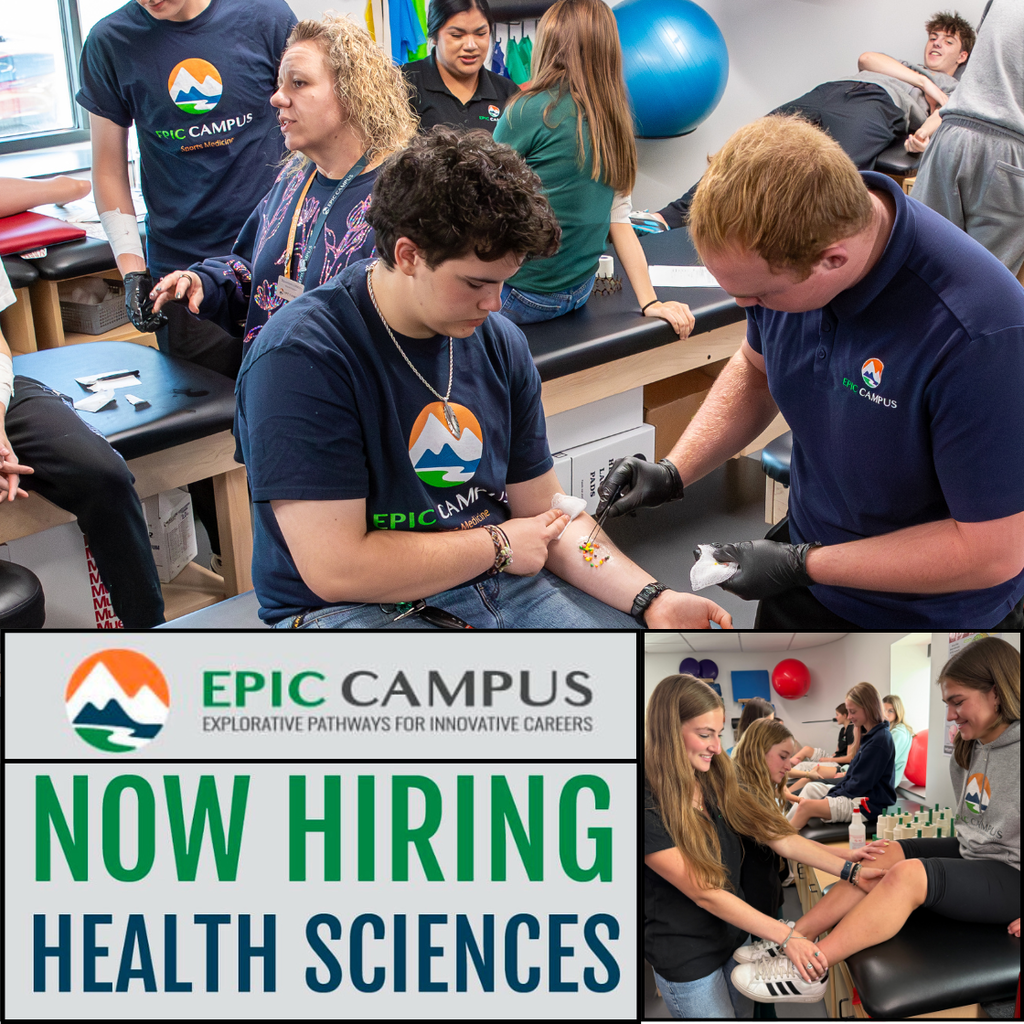 A diverse group of high school–aged students in a clinical classroom practice health science skills. In the foreground, a light-skinned teenage student with short dark curly hair sits while another light-skinned teenage student wearing black gloves carefully places small multicolored beads or markers on their forearm, simulating a medical procedure. Both wear navy shirts with the “EPIC Campus” logo. A middle-aged female instructor with curly blonde hair observes and guides nearby. In the background, additional students of varied genders and skin tones work in pairs on padded exam tables, practicing similar techniques. The room includes medical training equipment such as exam tables, exercise balls, and supplies.  At the bottom of the image, a graphic banner displays the EPIC Campus logo and the text: “EPIC CAMPUS – Explorative Pathways for Innovative Careers” and large bold text reading “NOW HIRING HEALTH SCIENCES.” To the right of the banner, another photo shows three female students smiling while practicing on a classmate’s leg in a similar lab setting.
