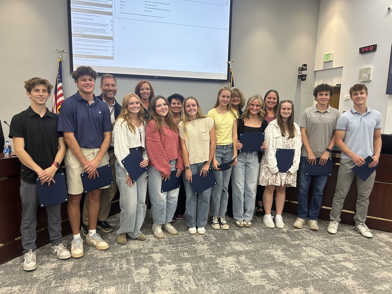 HHS's student government stands with the Board of Education in the Boardroom.