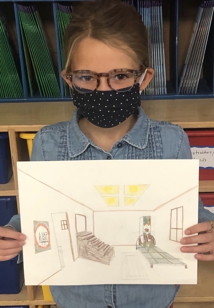 female student with a mask on holding her art drawing