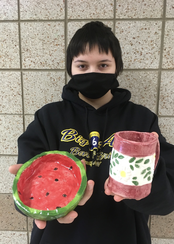 female student with a watermelon bowl and a mug