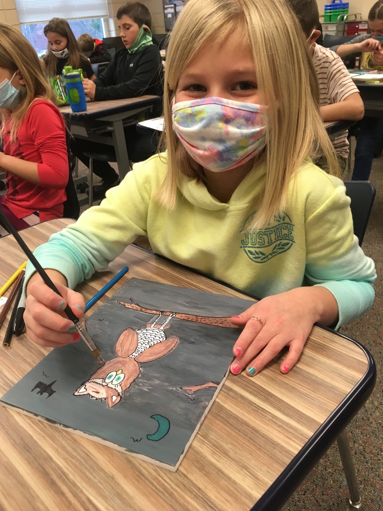 female student with an owl painting