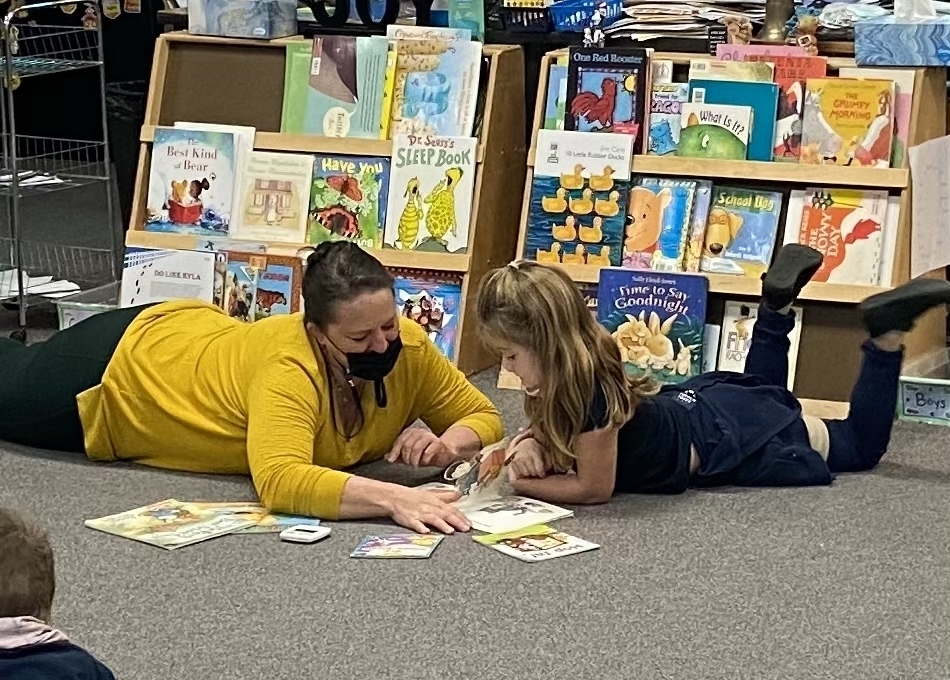 Teacher reading to student