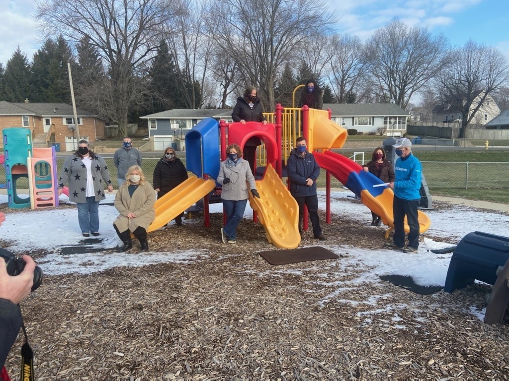 photo of people with playground equipment