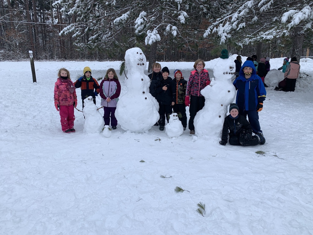 female and male students next to snow creatures