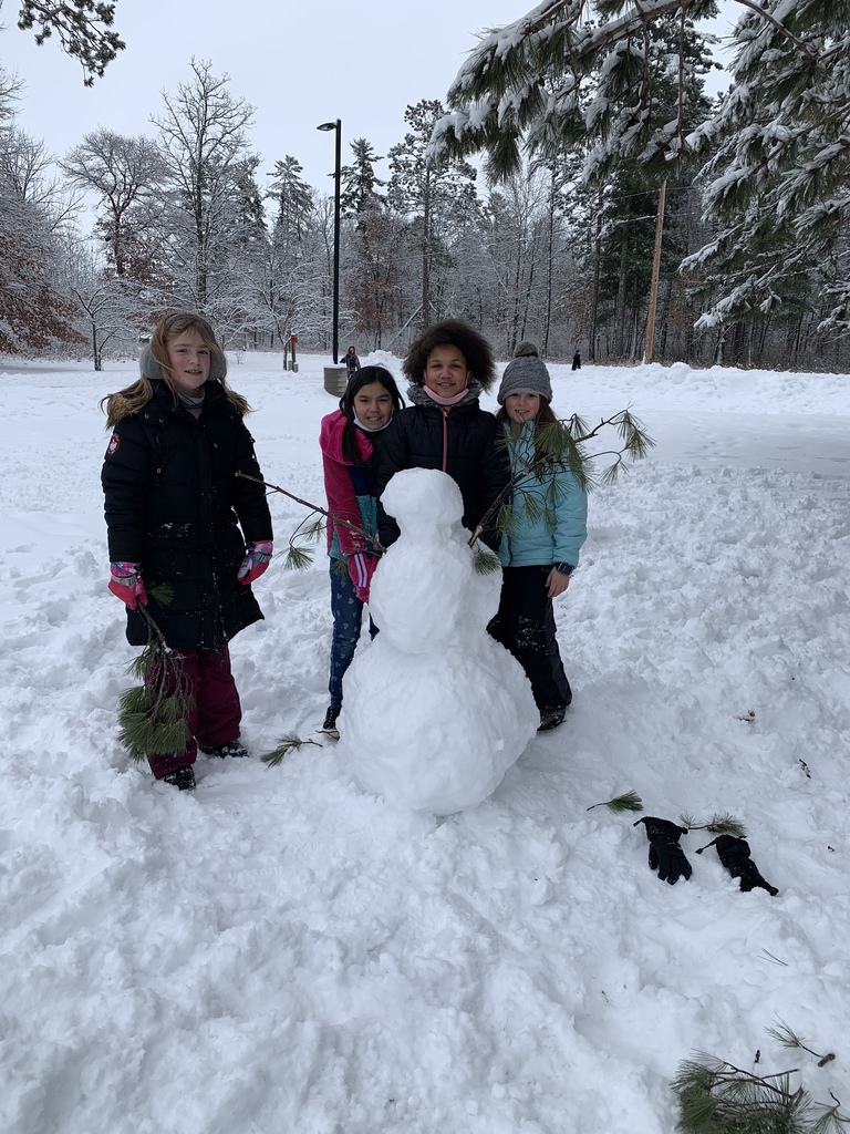 female students next to snow creatures