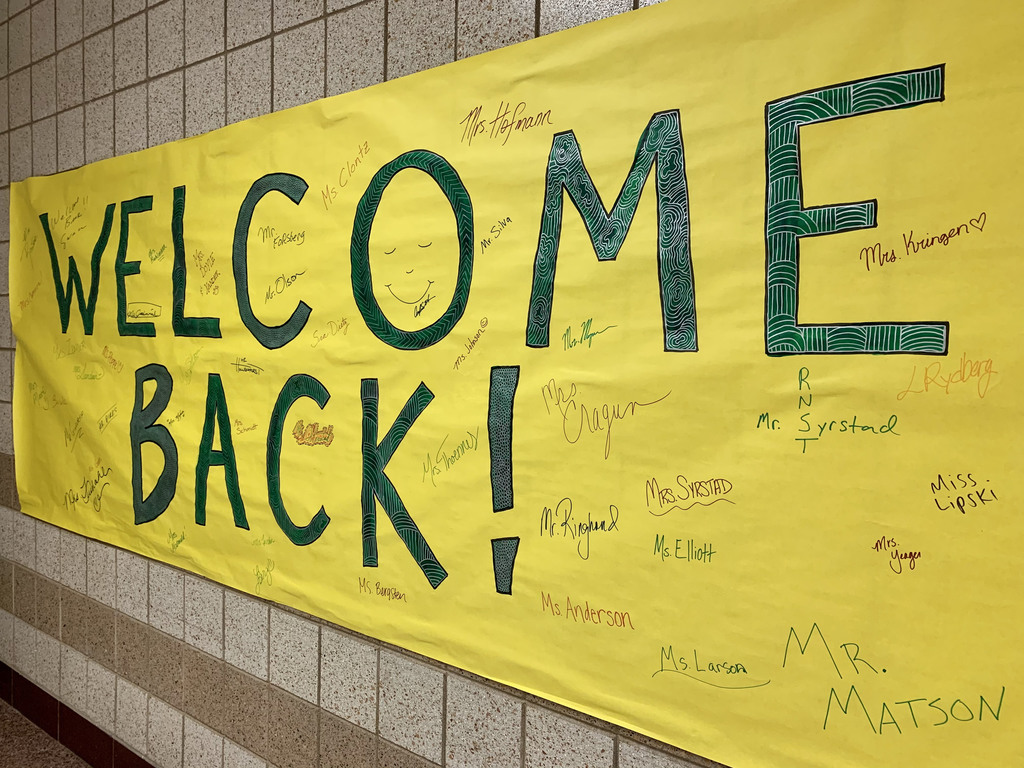 welcome back painted on yellow