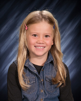 Katie was chosen as Student of the Month. Her teacher, Miss Ring says, “Katie is full of joy and wonderful in every way! She is kind, very smart, brave, creative, and she can make anyone smile and laugh! She is also an outstanding student. Katie does an amazing job on all of her assignments and she attends and participates in our Google Meets. Katie always brings out the best in others and she is so fun to be around. I am so grateful to have Katie as part of my class this year. Congratulations, Katie! Keep shining your light and being YOU!”   Katie is most proud that she gets to go back to school full time. Katie likes doing math and reading the most in school. Katie is most thankful for food. She likes pizza and tacos the most. Katie likes to play with her cousins when she is at home. They like to play dress up and be princesses or unicorns!    Katie, you are kind, thoughtful, and smart! We love you at Ogema Elementary!