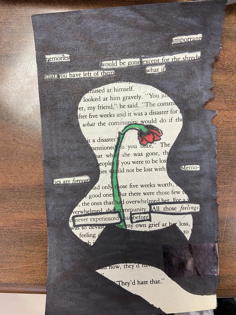 writing with black highlights and a flower