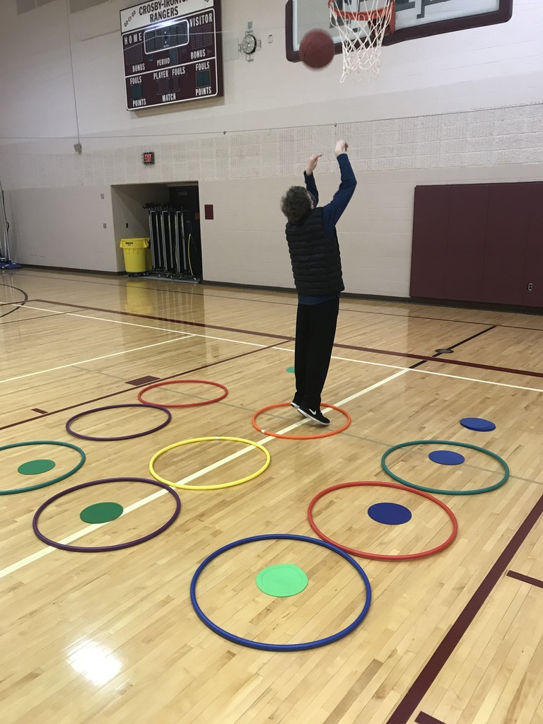 male student shoot a basketball