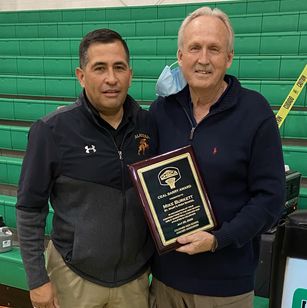 coach holding a plaque