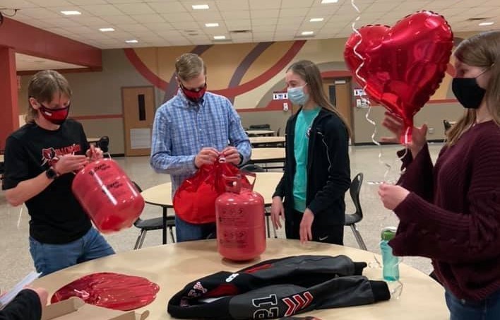 High School students filling balloons