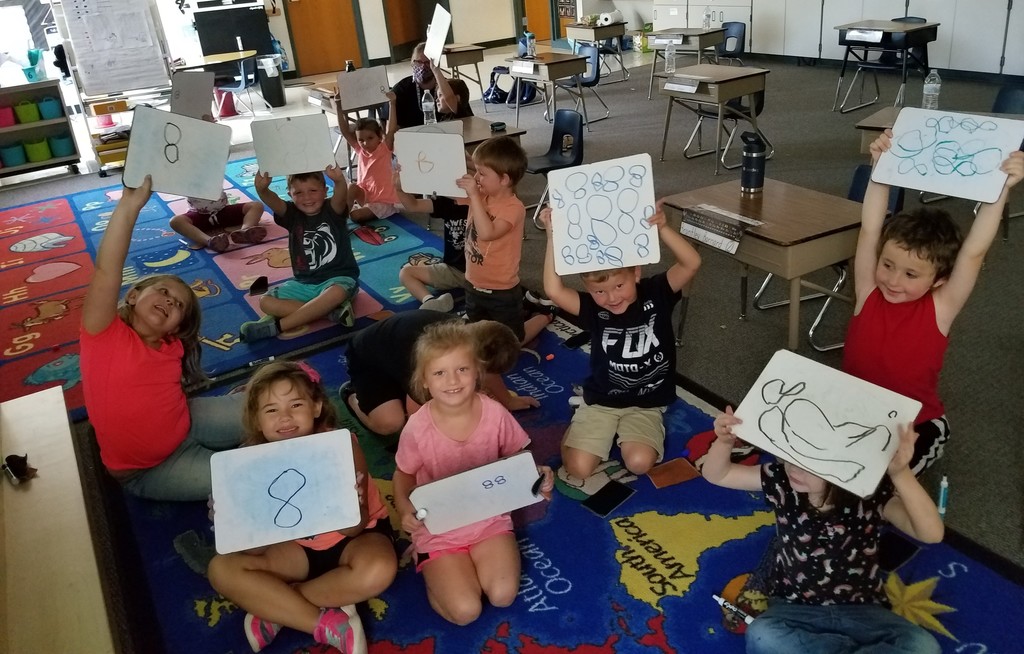 Kindergarten students working on the number 8