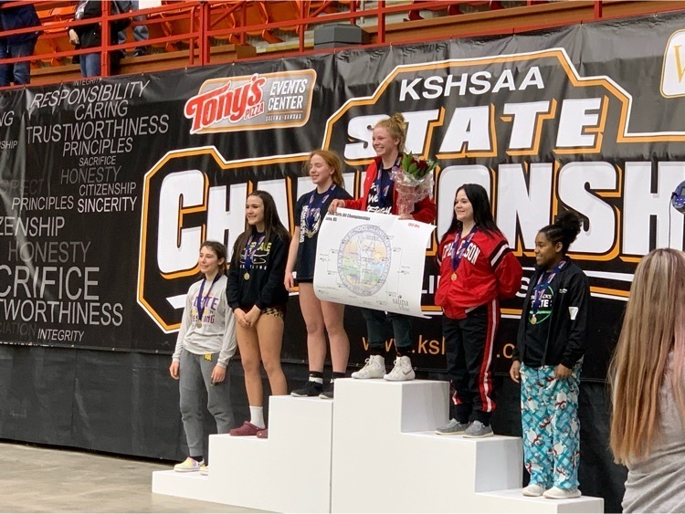 girls standing on a podium