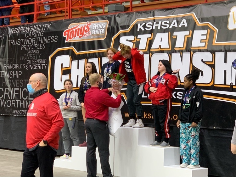 girls standing on a podium
