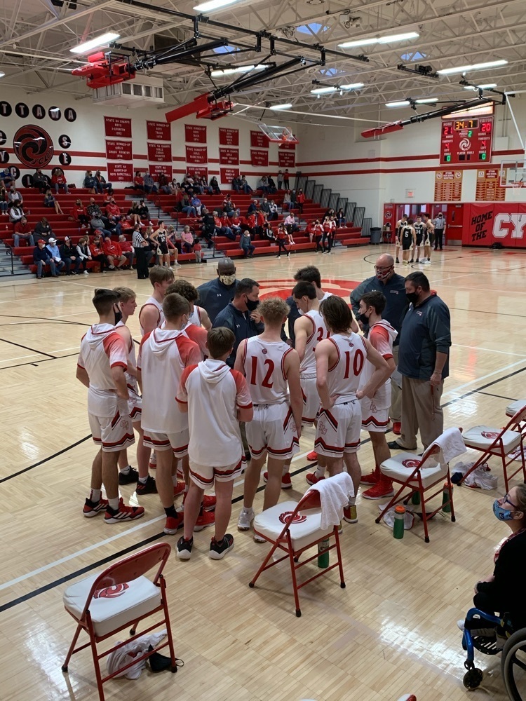 boys in a time out at a basketball game