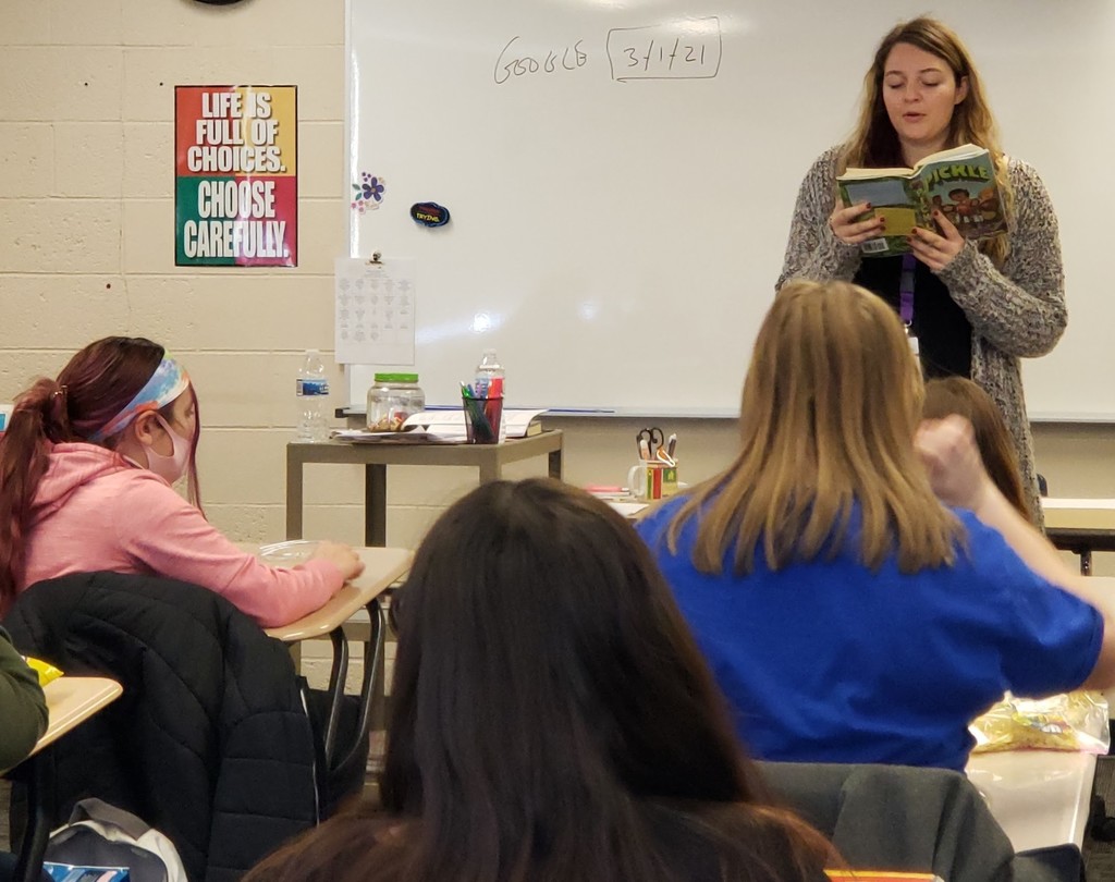 Student teacher reads to the class