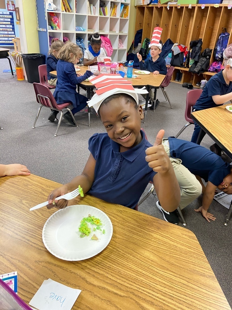 girl eating green eggs