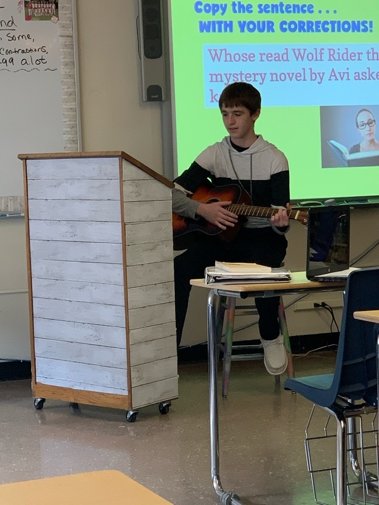student playing guitar