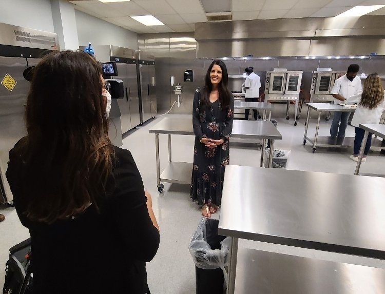 Ms McNew on TV in the culinary arts classroom