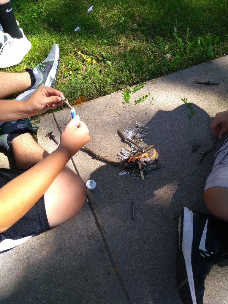Outdoor Club students make a small survival fire