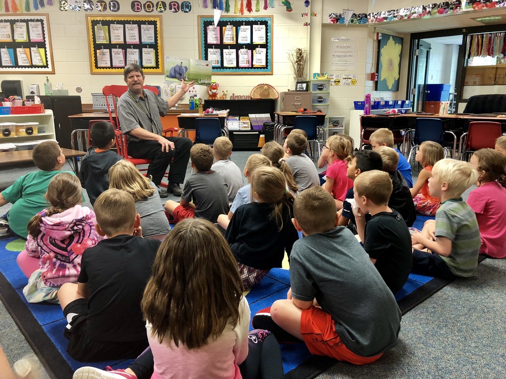Mark Schneider, superintendent, reads to second graders during National Read a Book Day
