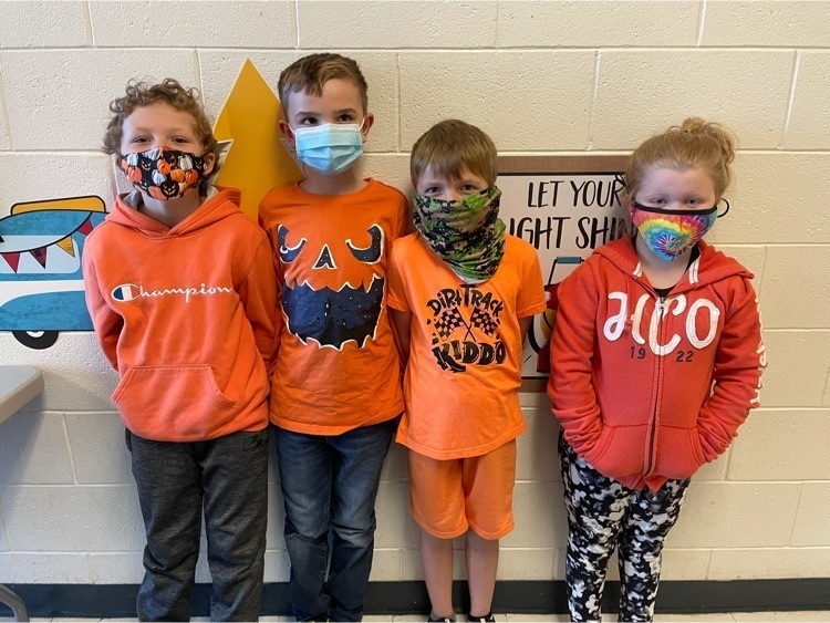 students wearing orange