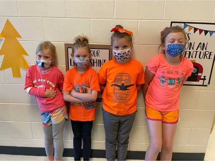 students wearing orange
