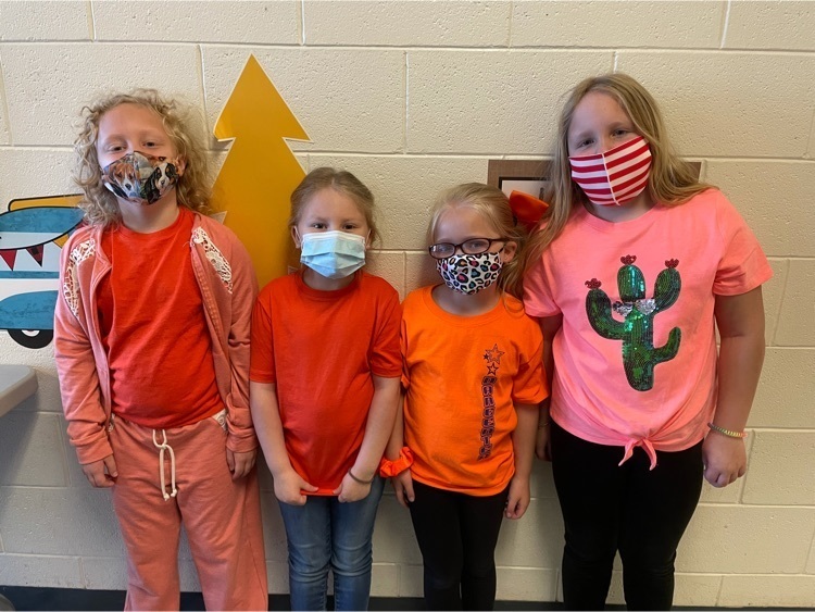 students wearing orange