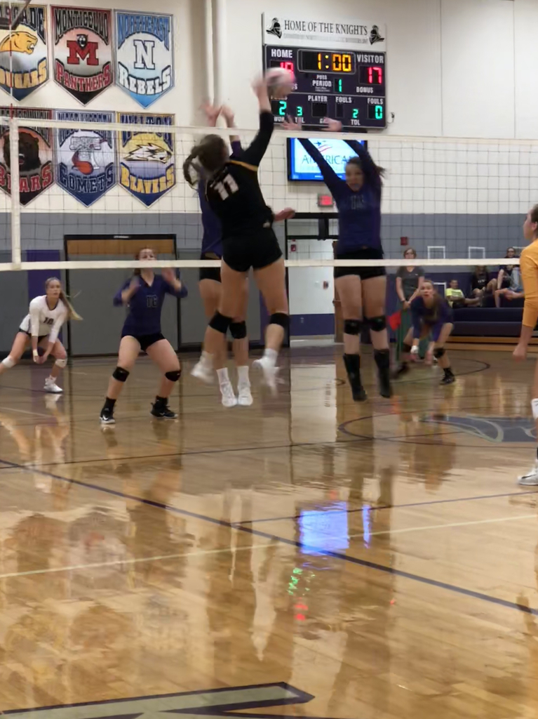 Mackenzie Rich hits through the hole in the Knight’s block.