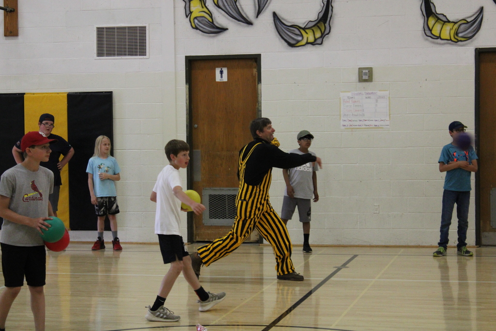 Superintendent Mark Schneider plays dodgeball during PE