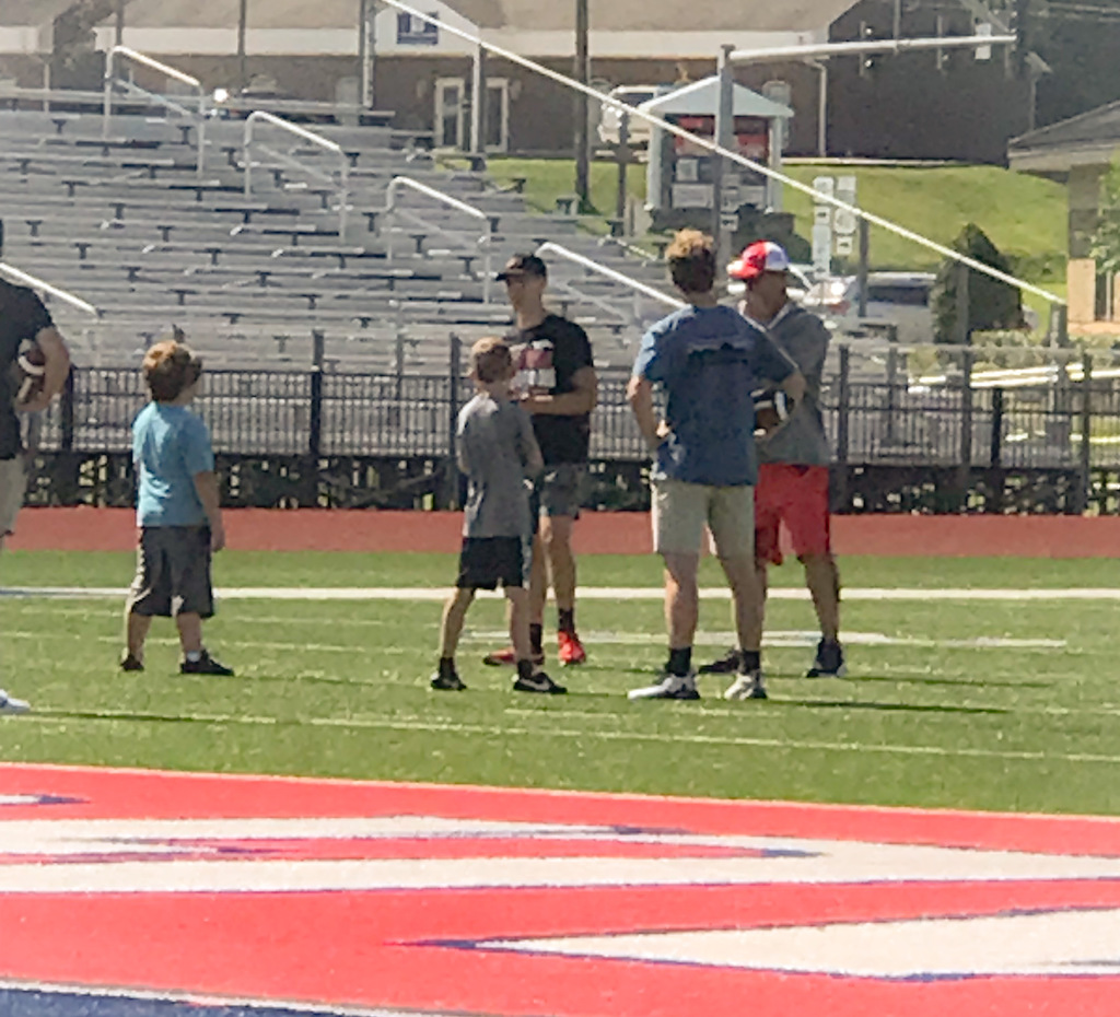 Coaches talking to athletes