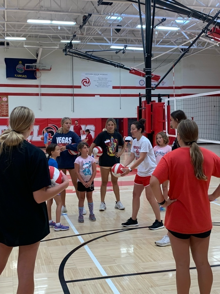 girls getting instruction about volleyball