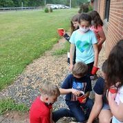 Planting flowers during farming week.